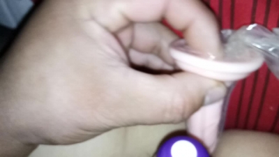 The prop is inserted into the pussy, and the white juice is coming out 