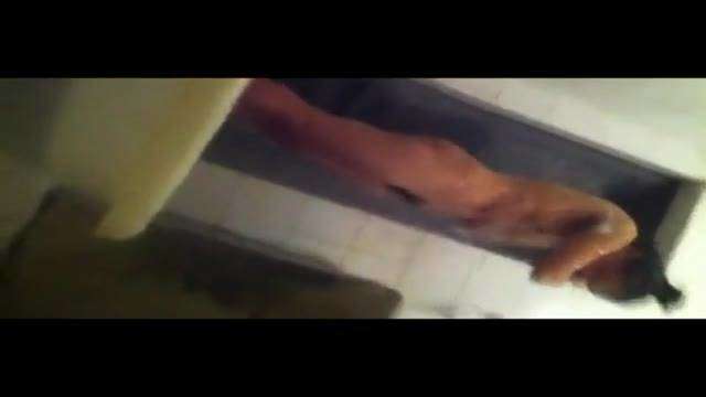 Secretly filmed Singapore girl taking a shower in the toilet 