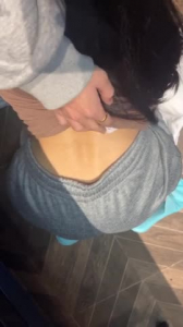 Chatting a beautiful young woman with a slim figure in a hotel 